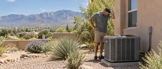 Illustration of a technician servicing an outdoor cooling unit beside a stucco home.